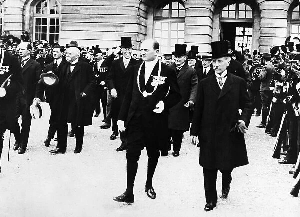 Cheering crowds greet French Premier Georges Clemenceau (thrird Left)