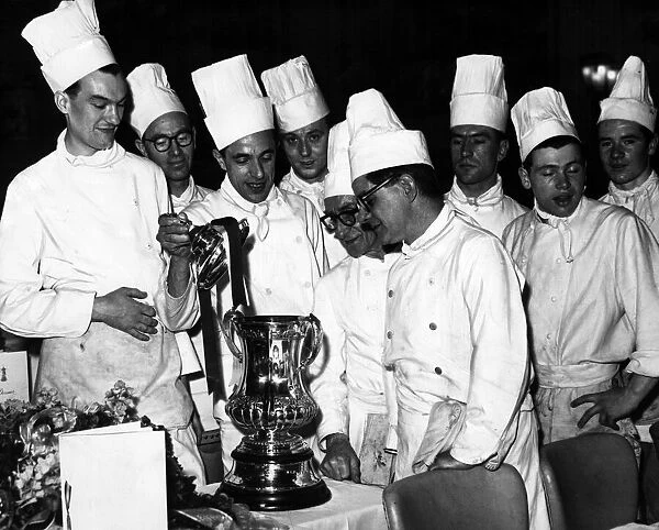 Chefs and Kitchen Staff admire the FC Cup at Villa Park