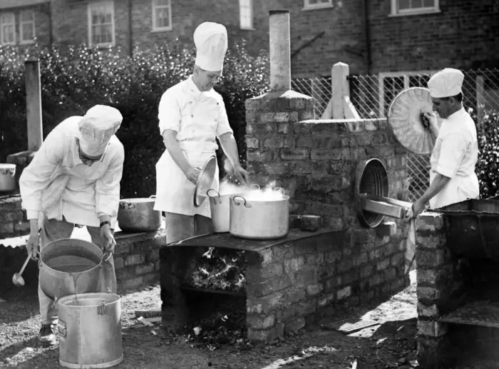Framed Print : Chefs from Liverpool Education Committee School, prepare a meal in a field kitchen using Framed Print : Chefs from Liverpool Education Committee School, prepare a meal in a field kitchen using