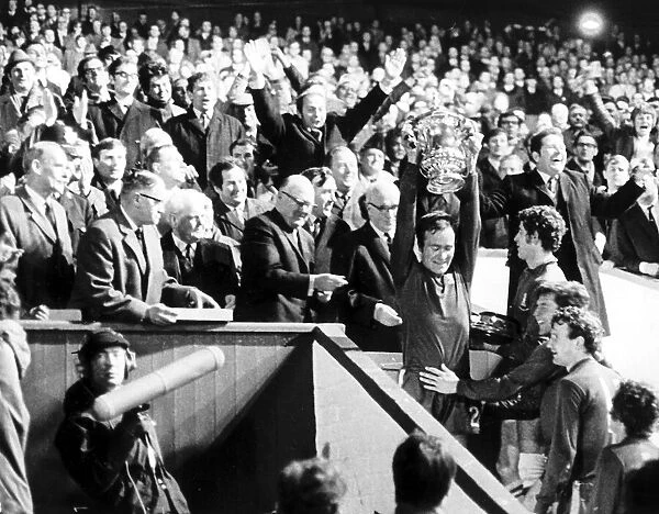 Chelsea captain Ron Harris lifts the FA Cup after they had beaten Leeds at Old Trafford