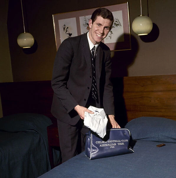 Chelsea footballer Peter Osgood in a hotel room packing his bag February 1966