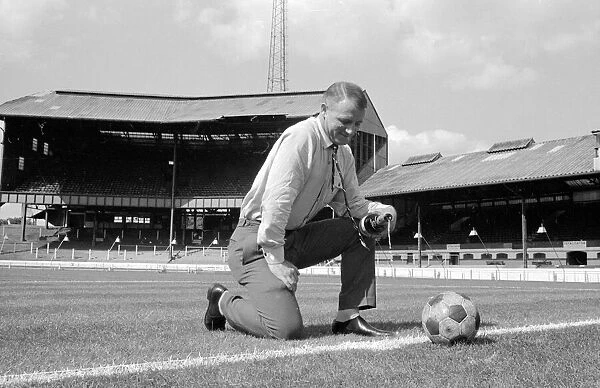 Chelsea manager Tommy Docherty christens the centre spot of the Stamford Bridge pitch