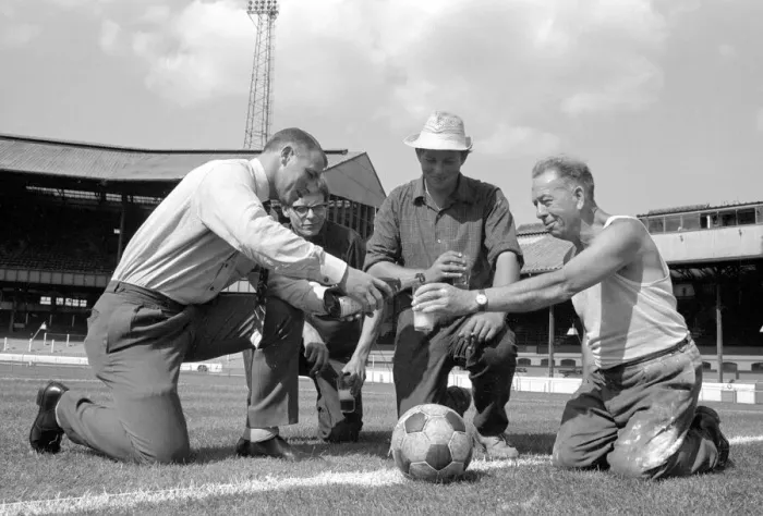 Framed Print : Chelsea manager Tommy Docherty christens the centre spot of the Stamford Bridge pitch Framed Print : Chelsea manager Tommy Docherty christens the centre spot of the Stamford Bridge pitch