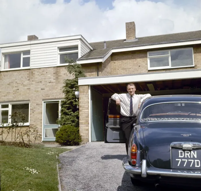Framed Print : Chelsea manager Tommy Docherty at home with his car on the driveway May 1967