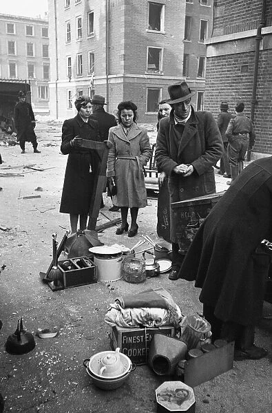 Chelsea residents with the few belonging salvaged from their bombed out following a raid
