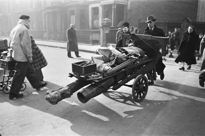 Framed Print : Chelsea residents with the few belonging salvaged from their bombed out following a raid