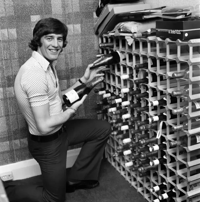 Framed Print : Chelsea striker Ian Hutchinson selects a suitable bottle of champagne in readiness for