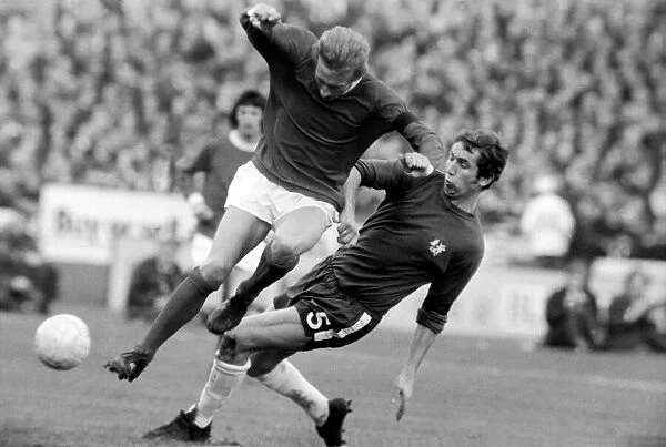 Chelsea v. Manchester United. Dennis Law of Manchester United pushes Marvin Hinton of