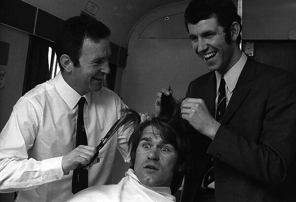 Chelseas manager Dave Sexton and centre forward Peter Osgood give Dave Webb a short