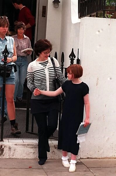 Cherie Blair outside her home with child. May 1997