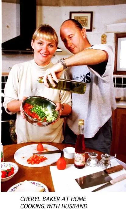 Framed Print : Cheryl Baker TV Presenter busy cooking in the kitchen of her house with her husband Steve