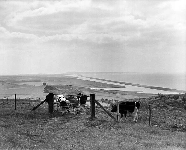 Chesil beach and Portland on the horizon, Dorset. Circa 1940