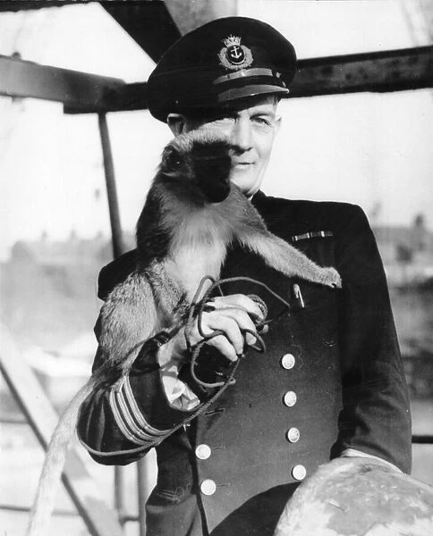 Chief Officer J Stevens and his monkey Jennie, aboard The Father Neptune