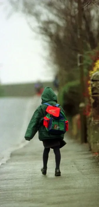 Framed Print : Child heads for lessons at Dunblane Primary School in the morning a year after Framed Print : Child heads for lessons at Dunblane Primary School in the morning a year after