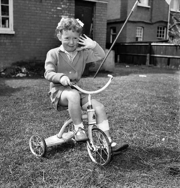 Child playing in garden. August 1953 D5235-008