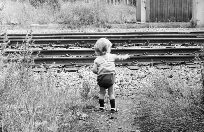 Framed Print : A child toddles terrifyingly close to an unprotected railway track Framed Print : A child toddles terrifyingly close to an unprotected railway track