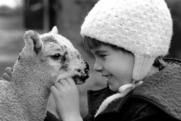 Children  /  Animals  /  Cute. Lamb and Child. December 1976 76-07533-011