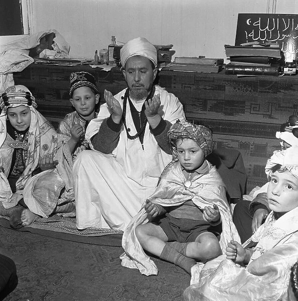 Children attend the Peel Street Mosque in Tiger Bay, Cardiff. 26th March 1954