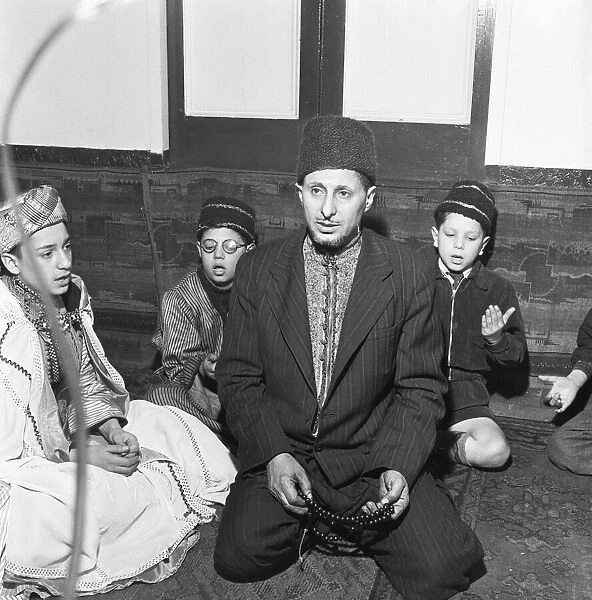 Children attend the Peel Street Mosque in Tiger Bay, Cardiff. 26th March 1954