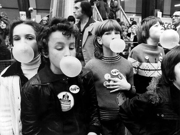 Children blowing bubble gum at Alexandra Palace. 11th March 1979