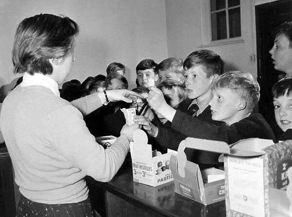 Children buying sweets at the tuck shop at St Chads Cathedral School in Lichfield