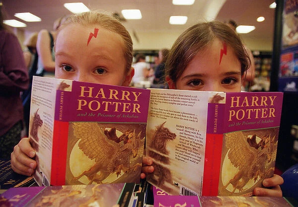 Children with copies of the new Harry Potter book Prisoner of Azkabar by Joanne Rowling