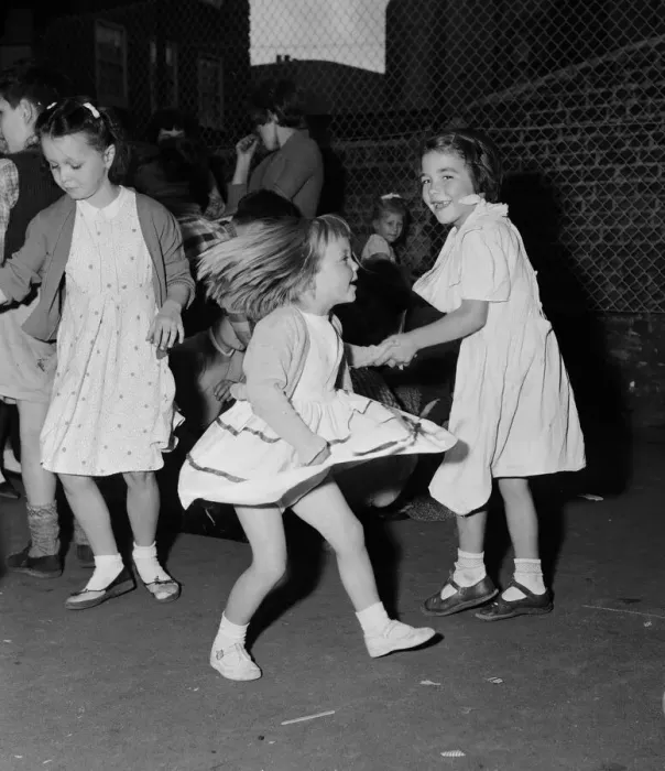 Framed Print : Children dancing to rock n roll music at a block of flats off Chapel Market