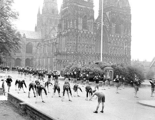Children doing their daily PT in the grounds of Lichfield Cathedral. September 1959