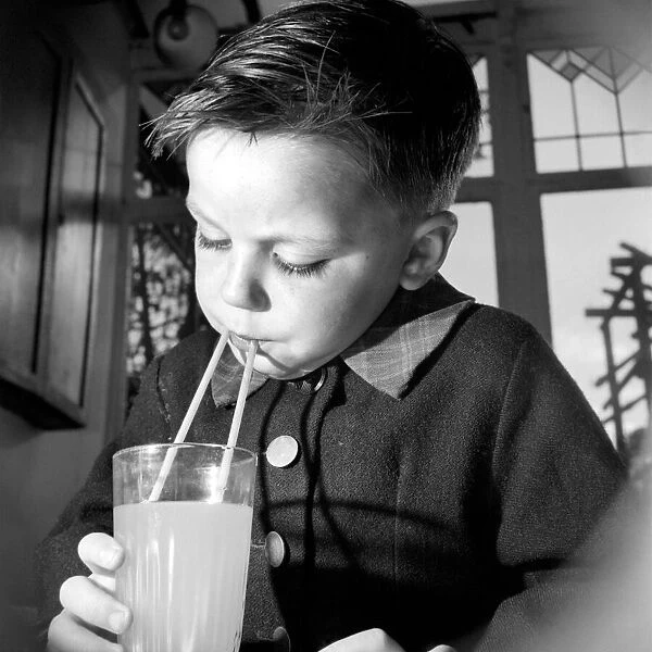 Children: Drink. Study picture taken of a four year old boy making the most of his