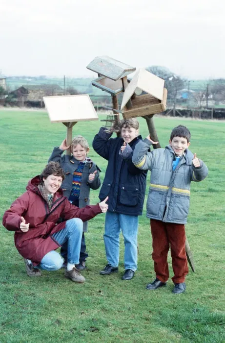 Framed Print : Children at Emley First School with bird tables donated to the school after an appeal in Framed Print : Children at Emley First School with bird tables donated to the school after an appeal in