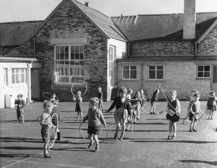 Framed Print : Children enjoy the playtime with skipping and hula hoops at Waterhouses School