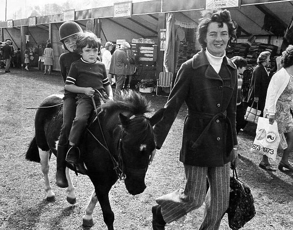 Children enjoy a pony ride in Southport. Circa 1973