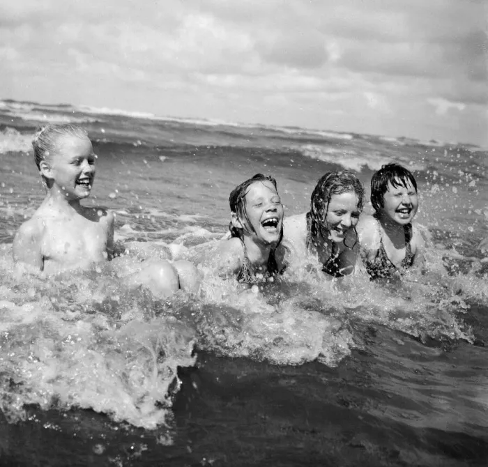Framed Print : Four children enjoy a swim in the sea at Blackpool beach in the summer holidays Framed Print : Four children enjoy a swim in the sea at Blackpool beach in the summer holidays