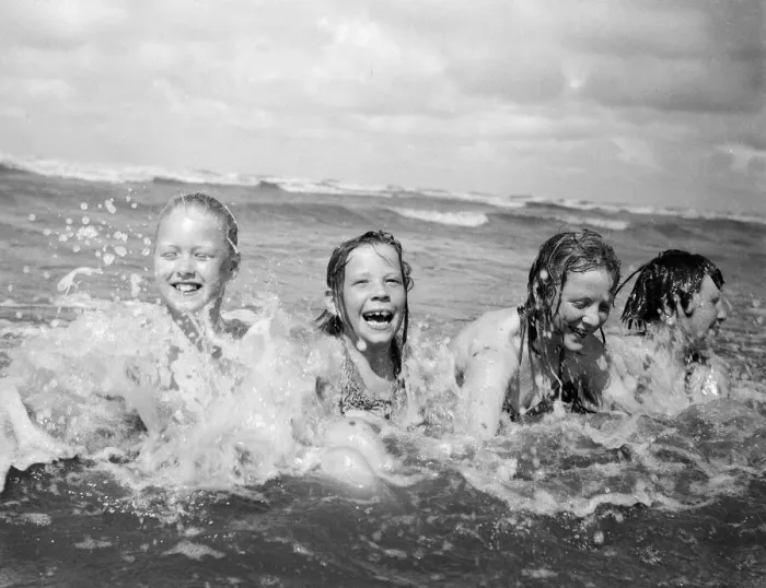 Framed Print : Four children enjoy a swim in the sea at Blackpool beach in the summer holidays Framed Print : Four children enjoy a swim in the sea at Blackpool beach in the summer holidays