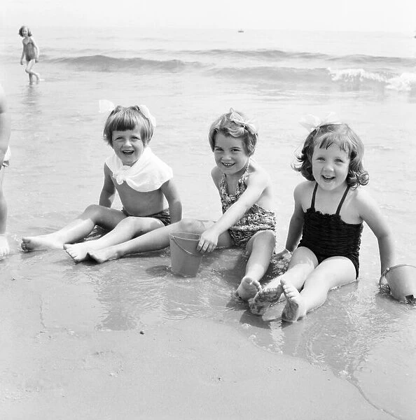 Children enjoying the water at Bournemouth Beach. June 1960 M4341-004