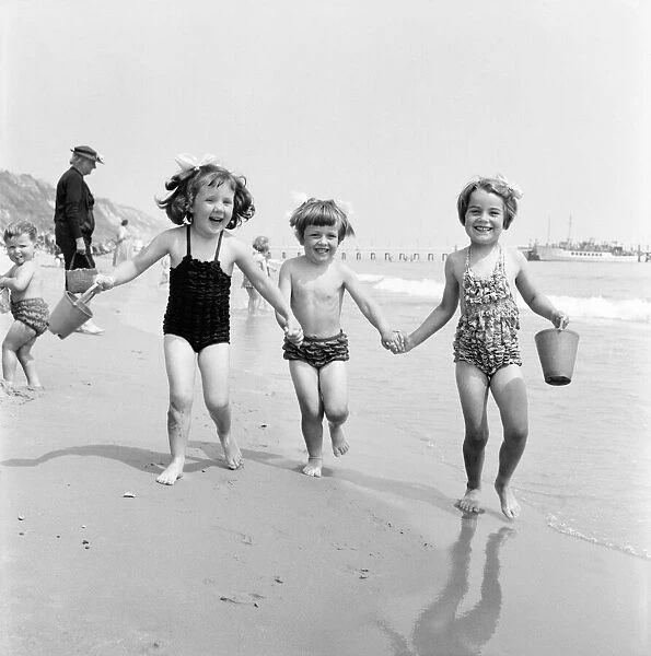 Children enjoying the water at Bournemouth Beach. June 1960 M4341-005