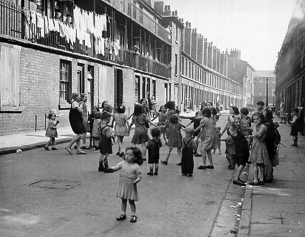 Children growing up in this poor street are accustomed to squalor