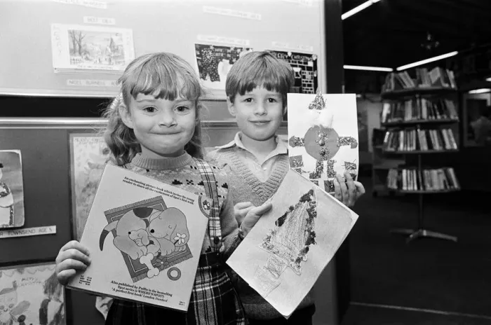 Framed Print : Children holing their entries for a Christmas card competition. Teesside, December 1985 Framed Print : Children holing their entries for a Christmas card competition. Teesside, December 1985