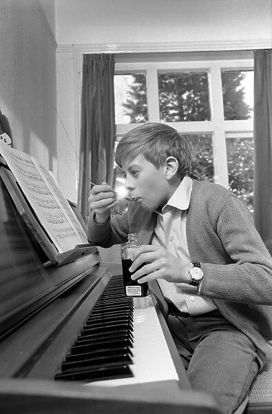 Children. Humour: Young boy at home setting at the piano. November 1969 Z11493-001