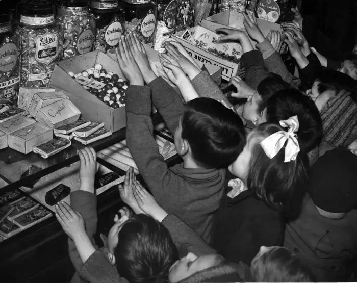 Framed Print : Children invade sweet shop after rationing ends in Glasgow, Scotland. 1949 Framed Print : Children invade sweet shop after rationing ends in Glasgow, Scotland. 1949
