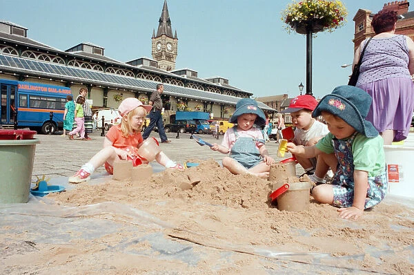 Children from Kids & Co. Nursery spend the morning playing with the sand in
