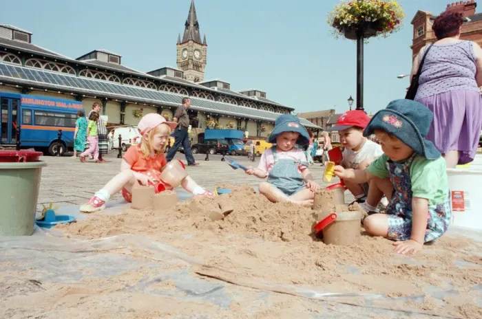 Framed Print : Children from Kids & Co. Nursery spend the morning playing with the sand in