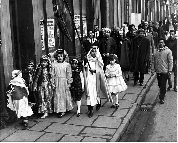 Children lead a procession of Moslems along Cardiff
