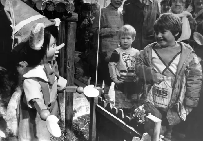 Framed Print : Children meet Pinocchio through the window of the Fenwick store in Newcastle Framed Print : Children meet Pinocchio through the window of the Fenwick store in Newcastle