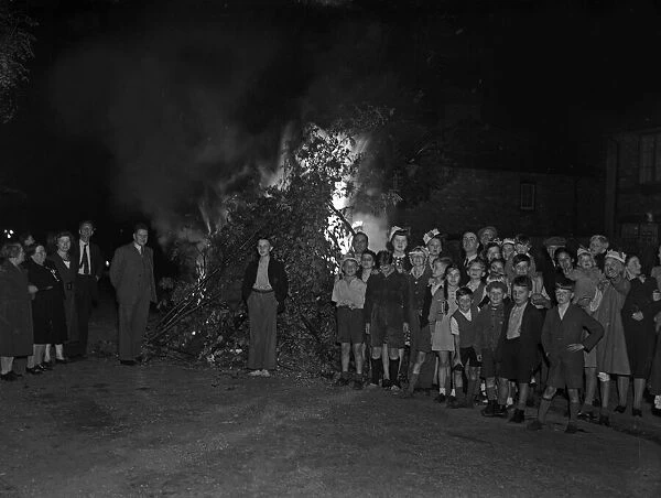 Children, Mums and Dad celebrate VJ Day by burning bonfires on the streets of Birmingham