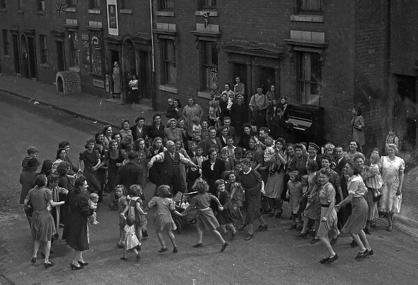 Children, Mums and Dad celebrate VJ Day on the streets of Birmingham 15th August 1945