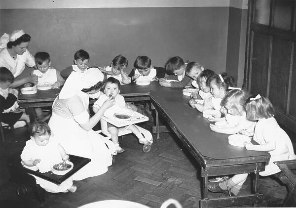 Children in Nursery while their mothers work. No date for picture
