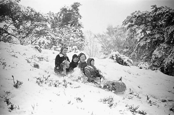 Children at Oxshott enjoying the winter snow. January 1939