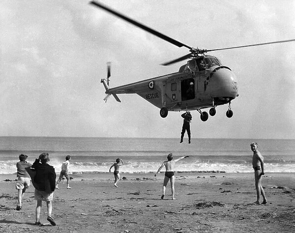 Children at play on Bridlington sands are thrilld at the sight of the RAF helicopter