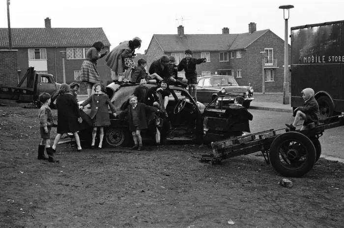 Framed Print : Children play on the wreck of a dumped car at Kirkby, Liverpool. 18th March 1965 Framed Print : Children play on the wreck of a dumped car at Kirkby, Liverpool. 18th March 1965